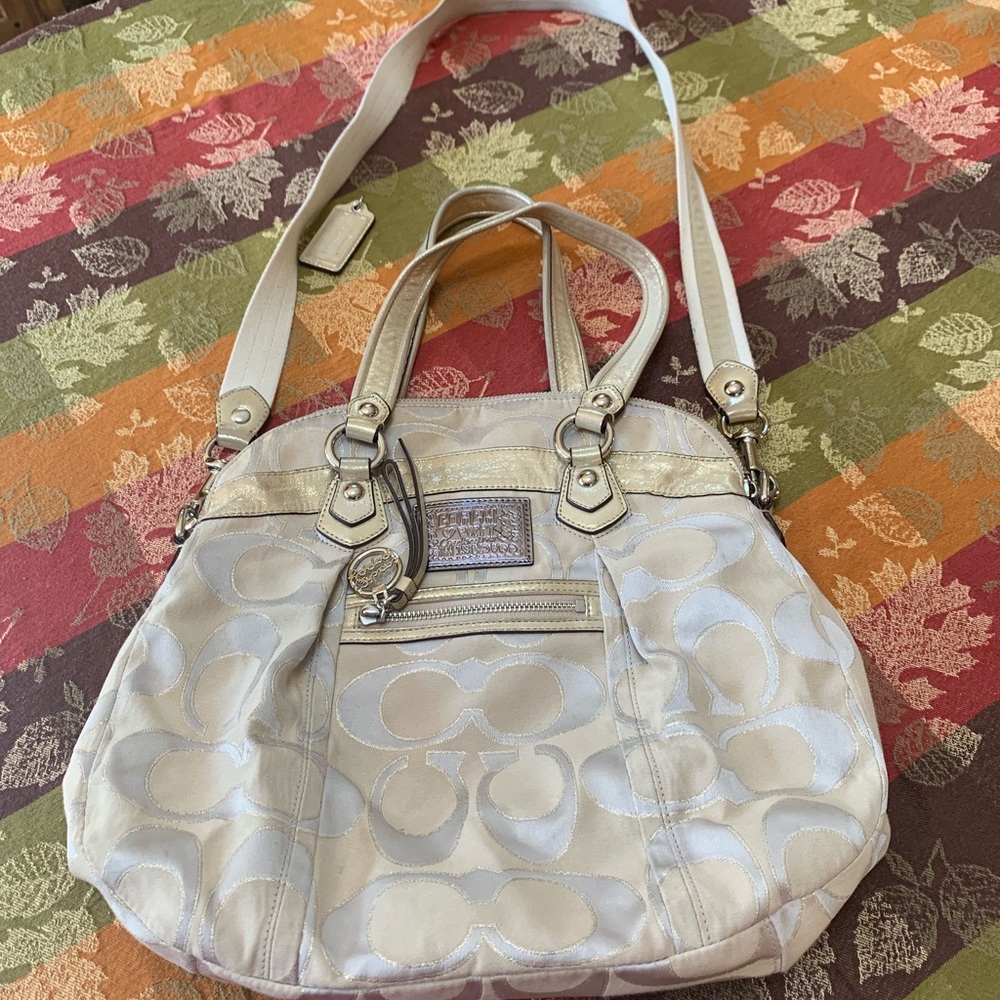 Authentic gold Coach Handbag. Slightly used.